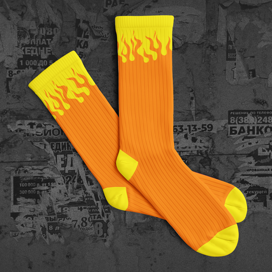 Orange socks with yellow flames on a dark background with text and numbers.